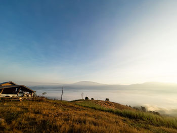 Scenic view of field against sky during sunset
