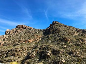 Low angle view of rock formations against sky