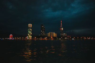 Illuminated buildings in city at night