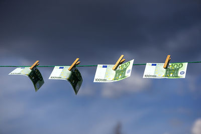 100 euro banknotes on a clothesline. money laundering theme.