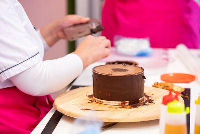 Midsection of woman having food