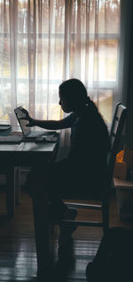 Man sitting on table at home