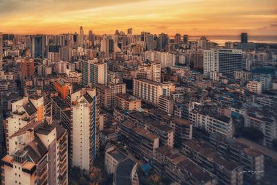 High angle view of cityscape against sky during sunset