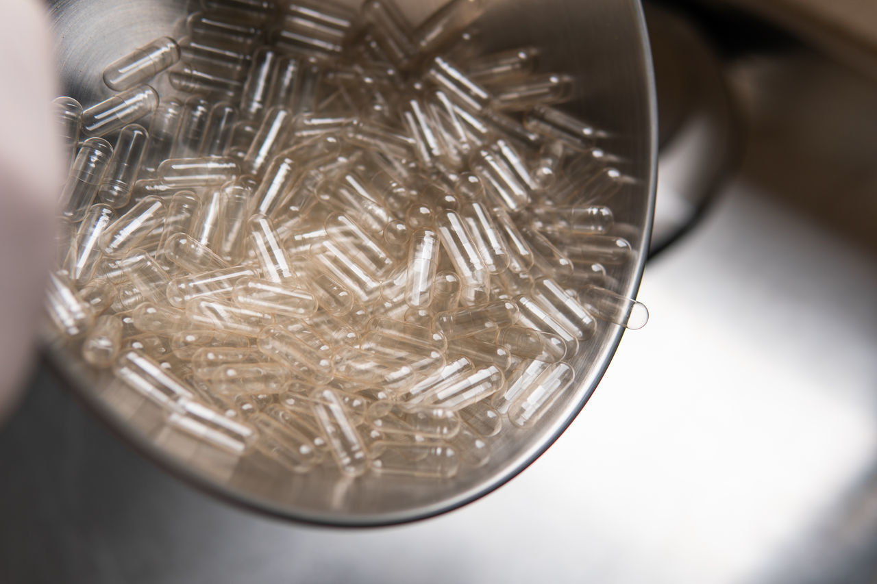 close-up, indoors, selective focus, glass, money, macro photography, no people, silver, metal