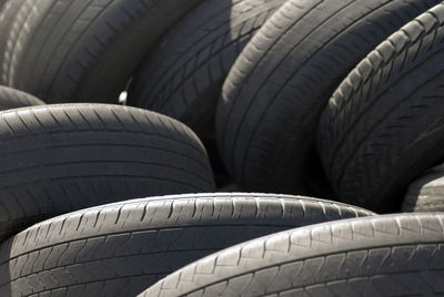 A pile used car tyres awaiting recycling