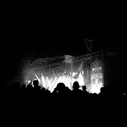 Silhouette people at music concert