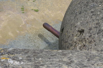 Close-up of stone on sand