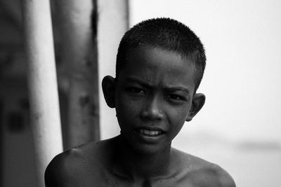 Close-up portrait of shirtless man