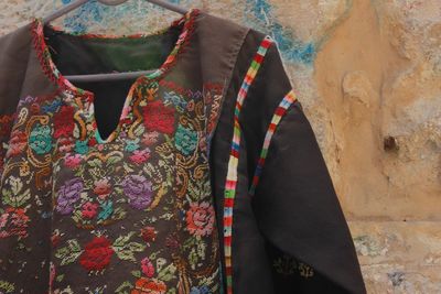 Close-up of colorful floral pattern womenswear on wall