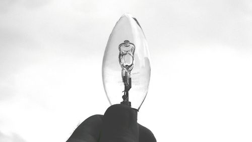 Person holding umbrella against white background