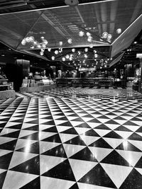 Low angle view of illuminated shopping mall