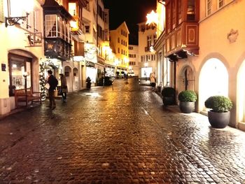 View of buildings in city at night