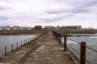 Bridge over river against sky