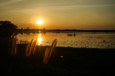 Scenic view of sunset over lake