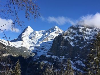 Scenic view of snowcapped mountains against sky