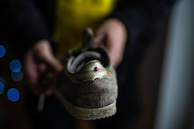 Close-up of man working on metal