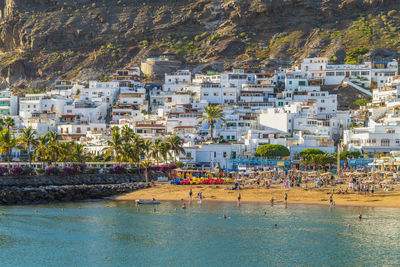 High angle view of townscape by sea