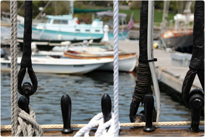 Close-up of ropes at harbor