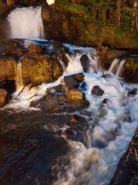 Stream flowing through rocks