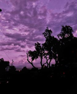 Silhouette trees against dramatic sky