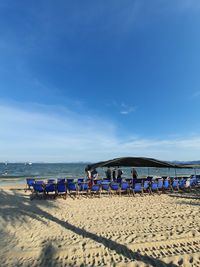 Scenic view of beach against blue sky