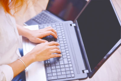 Close-up of woman using mobile phone