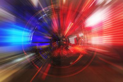 Light trails in illuminated tunnel