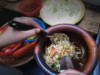 High angle view of person preparing food on table