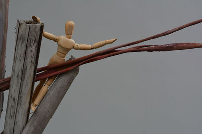 Low angle view of barbed wire against sky