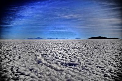 Surface level of land against blue sky