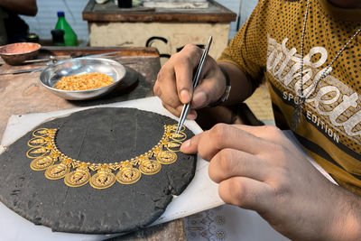 Midsection of man preparing food