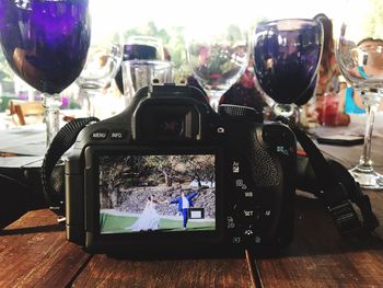 Close-up of camera on table