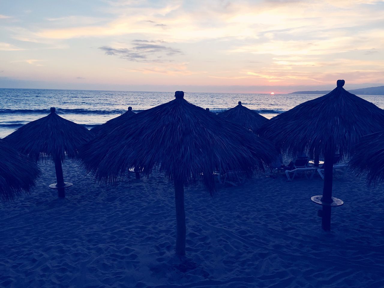 sea, horizon over water, water, sunset, sky, tranquil scene, scenics, beach, tranquility, beauty in nature, idyllic, cloud - sky, nature, shore, cloud, silhouette, orange color, vacations, remote, sand