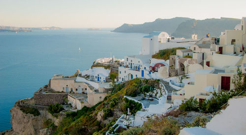 High angle shot of built structures against calm sea