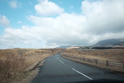 Road amidst landscape against sky