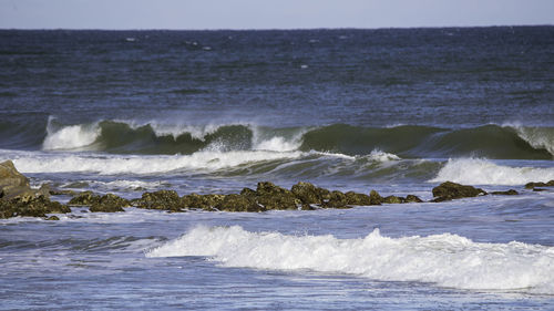 Scenic view of sea against clear sky