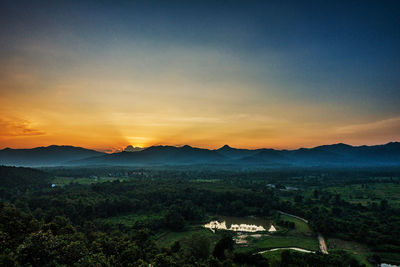 Scenic view of landscape against sky during sunset