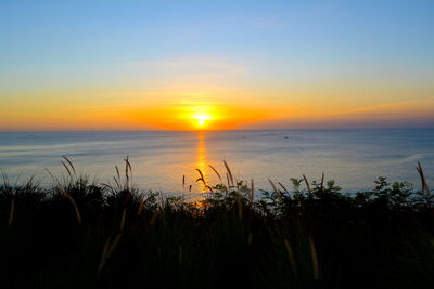 Scenic view of sea against sky during sunset