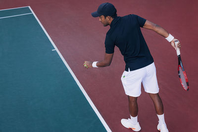 Low section of man playing tennis