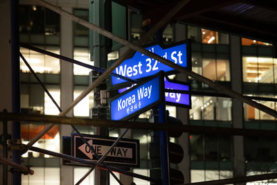 Low angle view of road sign at airport