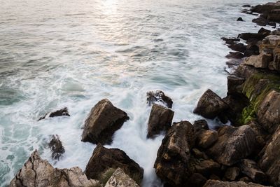 High angle view of rocks in sea