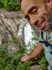 Portrait of man smiling outdoors