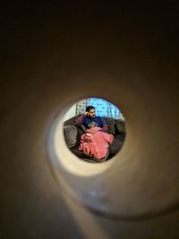 Reflection of woman in glass mirror