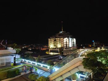 High angle view of illuminated buildings in city at night