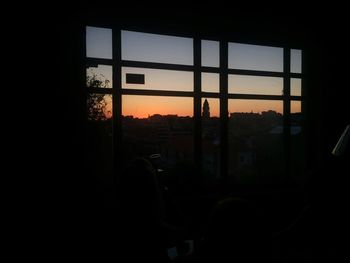 Silhouette of building at sunset