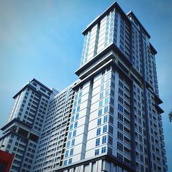 Low angle view of modern buildings against clear sky