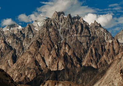 Low angle view of rock formations against sky