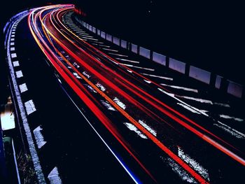 High angle view of light trails on road at night