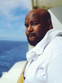 Portrait of bald man standing in ship