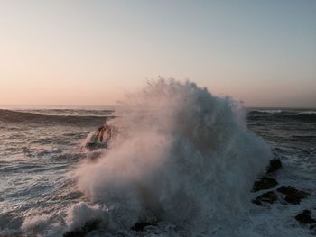 Scenic view of sea against sky at sunset